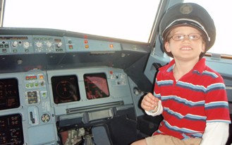 flygal1 Child in airplane cockpit.