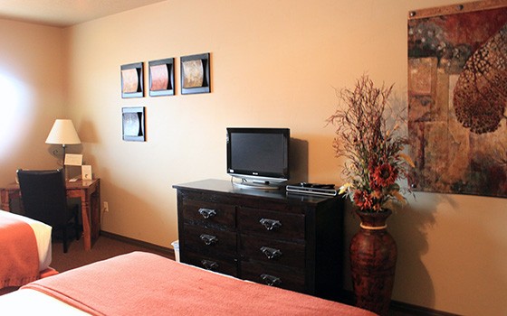 Artwork and accents in the guest rooms help create a classy, cozy vibe.