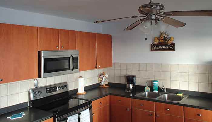 Full kitchen in our high-rise Luquillo apartment rental. 